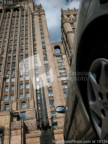 Image of wheel and sky-scraper