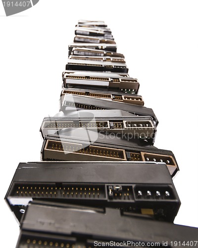 Image of high stack of used hard drives