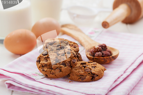 Image of Christmas chocolate and nut cookies with glass of milk