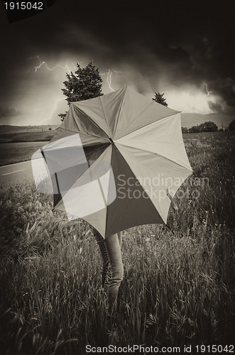 Image of Woman with colorful Umbrella in Tuscany Spring Countryside