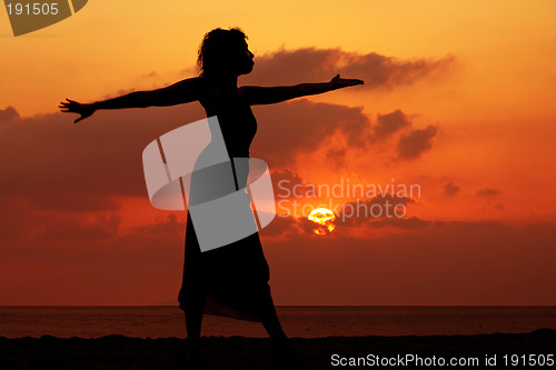 Image of Woman at sunset