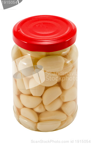 Image of Glass jar pot of preserved garlic isolated 