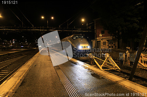 Image of Railway station by night.