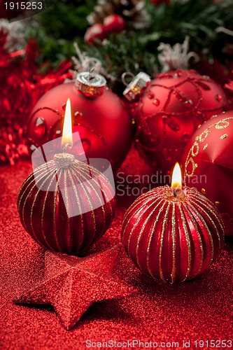 Image of Christmas candles and balls in red