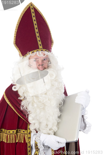 Image of Sinterklaas using a laptop