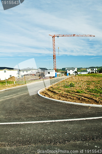 Image of houses estate with crane