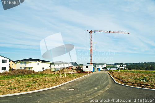 Image of houses estate with crane