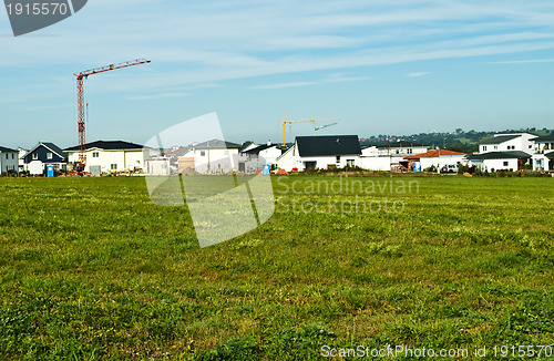 Image of houses estate with crane