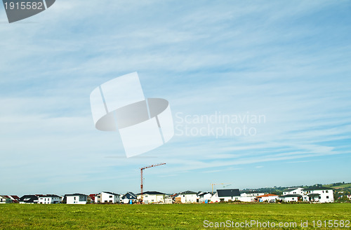 Image of houses estate with crane