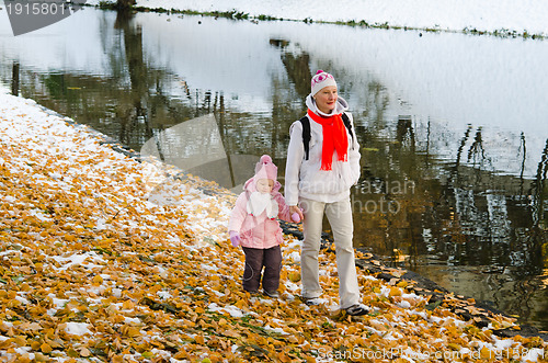 Image of grandmother with the grand daughter in autumn park