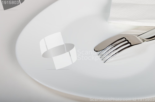 Image of Plug and knife on a white plate