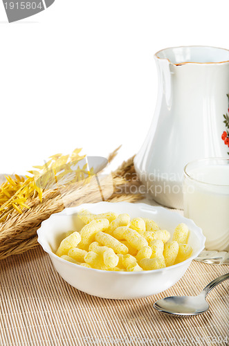 Image of Breakfast. A glass of milk and corn flakes 