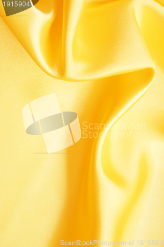 Image of Smooth elegant golden silk as background 