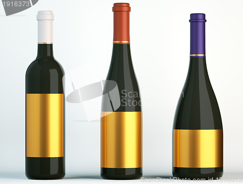 Image of Three bottles for wine with blank golden labels