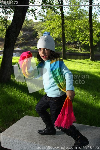 Image of Cute girl in autumn park