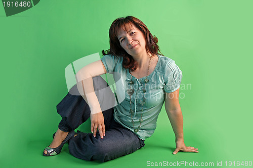 Image of fashion woman on green background. studio shot.