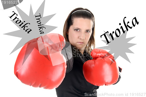 Image of Portrait of a young businesswoman wearing boxing gloves