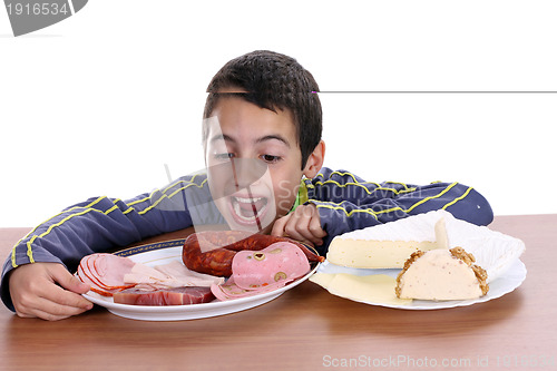 Image of hungry boy for cheese and sausage, food photo