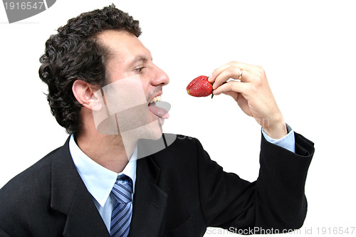Image of man with strawberries, healthy food photo