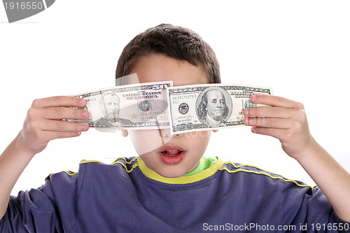 Image of boy blinded by money, studio photo