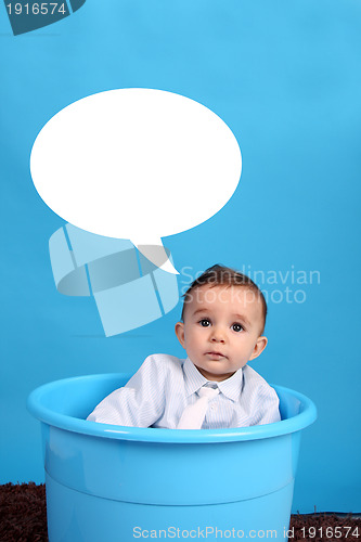Image of baby on a blue bucket, studio shoot