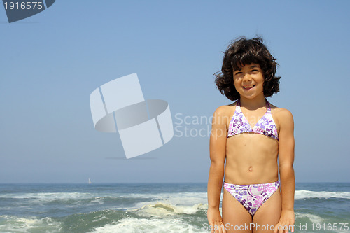 Image of beautiful girl in bikini in the beach, summer photo