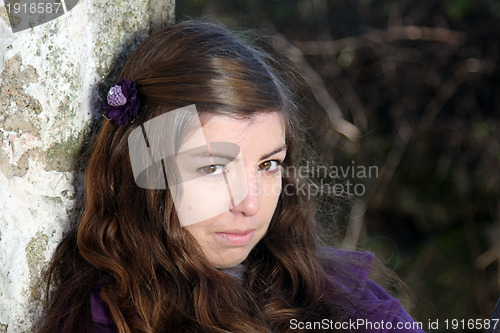 Image of  beautiful woman in an autumn park 