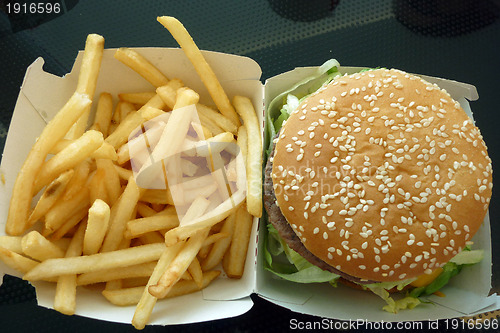 Image of Tasty hamburger with fries, unhealthy food, health concept