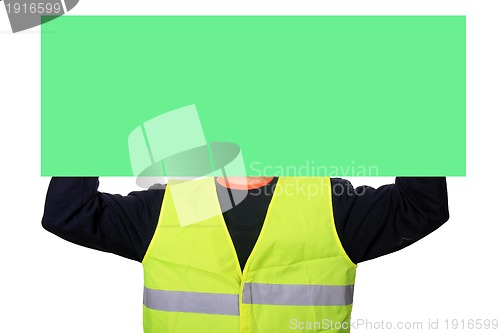 Image of Portrait of a worker with green publicity board