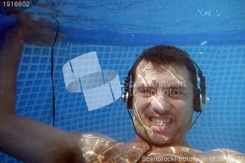 Image of man underwater listen music with head-phones