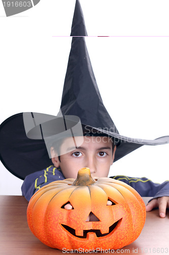 Image of big pumpkin with black witch wizard halloween (focus on the pump
