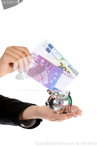 Image of hand holding a euro bill, business studio photo