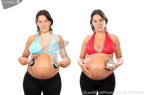 Image of beautiful pregnant woman with headphones in belly