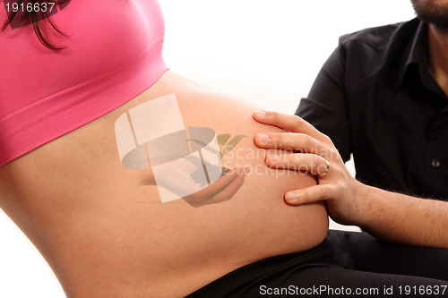 Image of beautiful pregnant woman expecting a baby girl