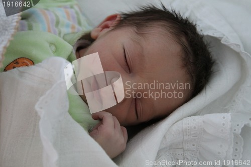 Image of sweet baby sleeping on a blanket, newborn baby