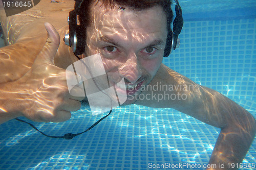 Image of man underwater listen music with head-phones