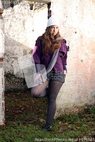 Image of  beautiful woman in an autumn park 