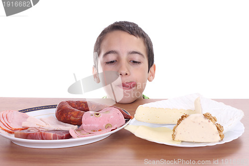 Image of hungry boy for cheese and sausage, food photo