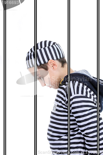 Image of A view of a sad prisoner in jail 