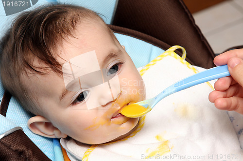 Image of beautiful child eating soup, food child photo