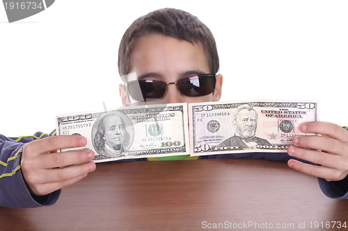 Image of boy blinded by money, studio photo