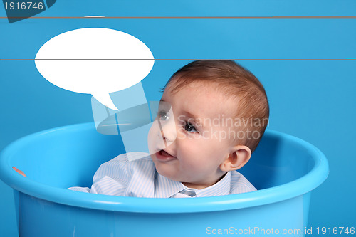 Image of baby on a blue bucket, studio shoot, baby bubble talk