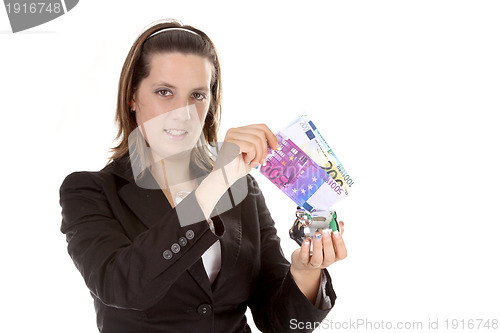 Image of hand holding a euro bill, business studio photo