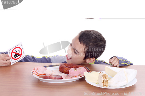 Image of hungry boy for cheese and sausage, food photo