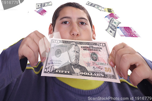 Image of boy with dolares and euros, business studio photo