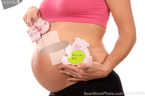 Image of beautiful pregnant woman expecting a baby girl