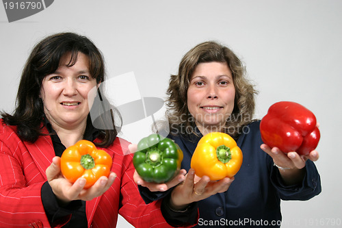 Image of woman with colored peppers, healthy food photo