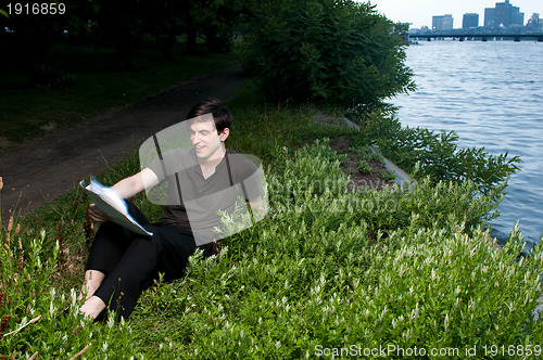 Image of Man reading papers