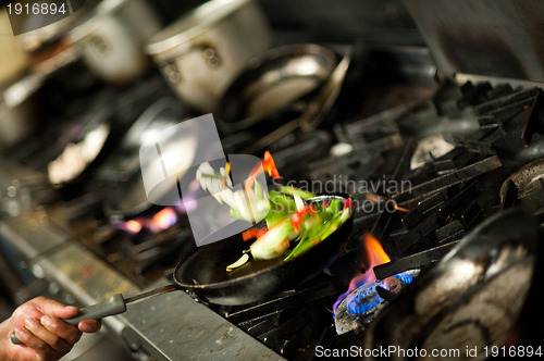 Image of Tossing vegetables