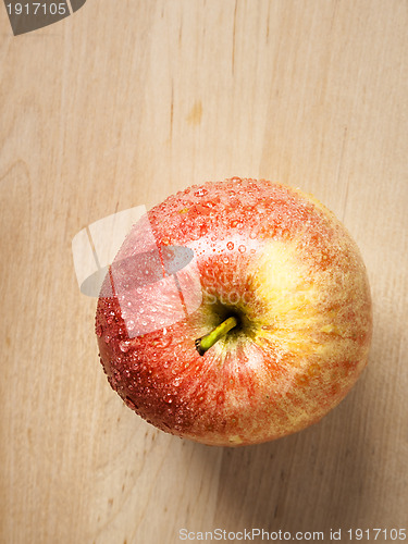 Image of apple on wood